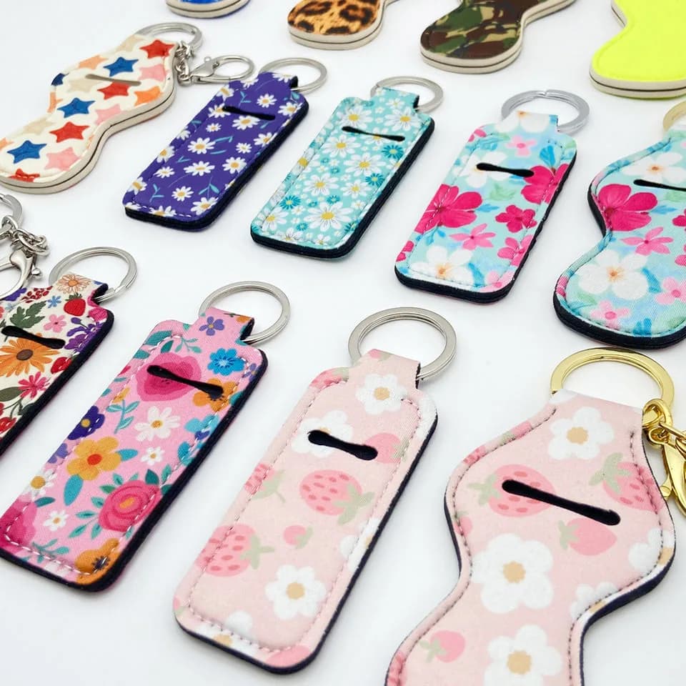 Assorted rectangle and contoured printed lip balm holder keychains