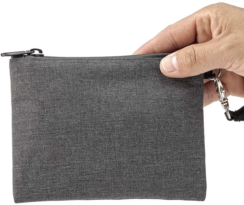 Actual gray polyester travel pouch held at the closed top zipper