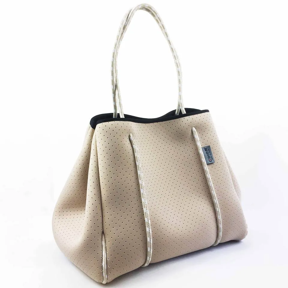 Light metallic-look perforated neoprene tote with rope handles and sides drawn in