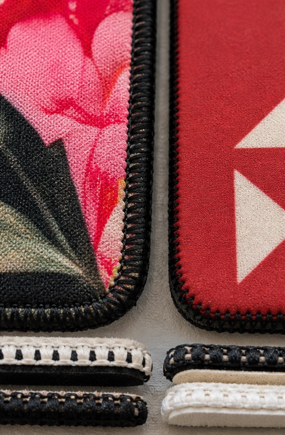 AI-generated macro illustration comparing colorful and spot-color printed neoprene with stitched edges