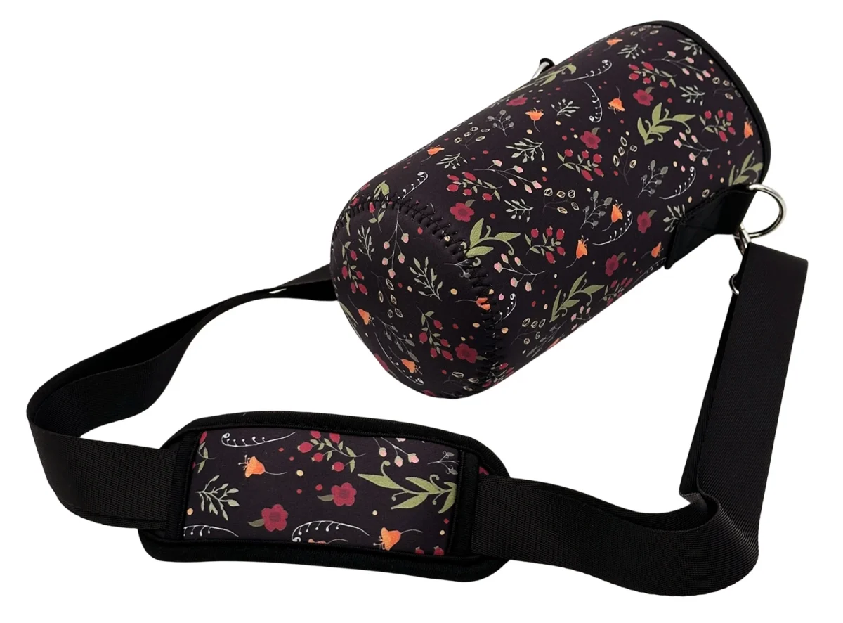 Floral bottle holder showing the sewn round base, strap and shoulder pad