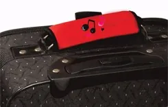 Red printed wrap fitted around the carry handle of a suitcase