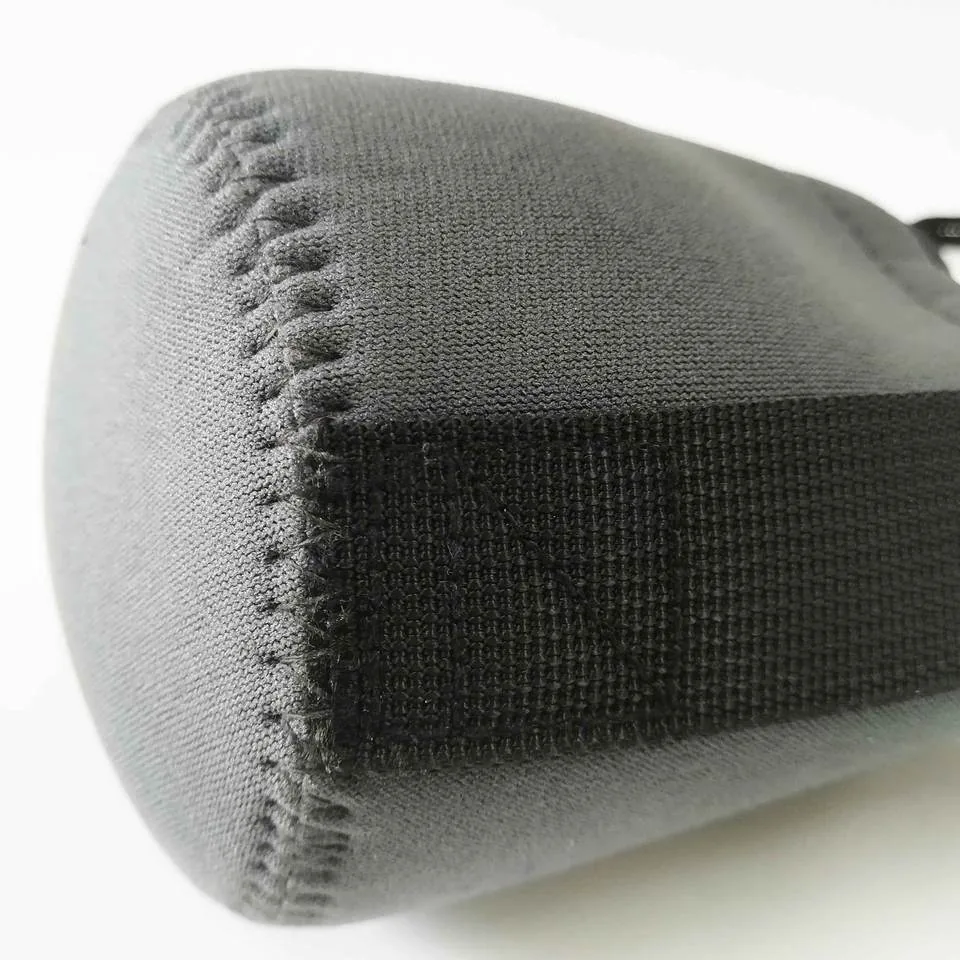 Circular base seam and webbing strip on the lens pouch