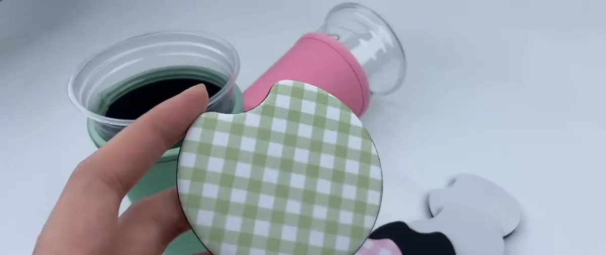 Actual demonstration still of a green checked coaster print