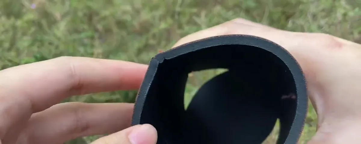 Actual video still showing the black inner layer and folding bottom