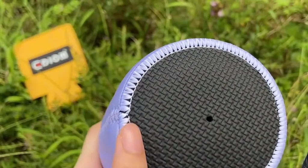 Actual video still showing the textured round base
