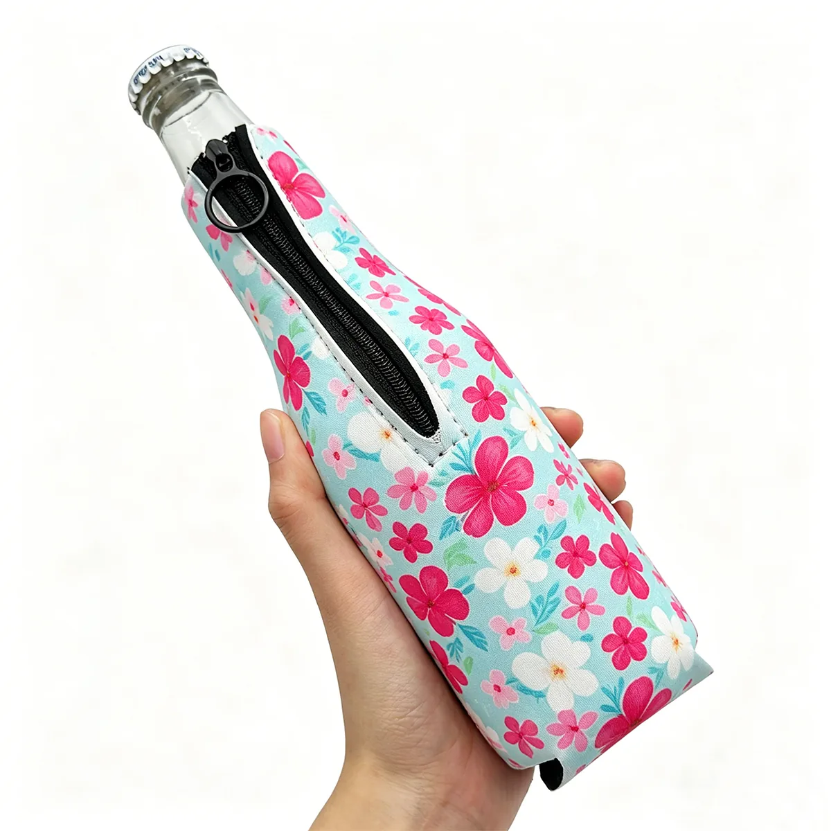 Floral neoprene zipper sleeve around a bottle