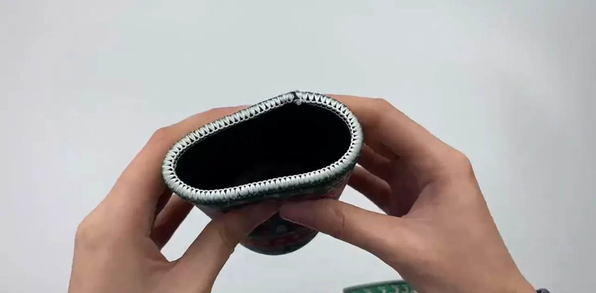 Actual video still showing the flexible sleeve opening