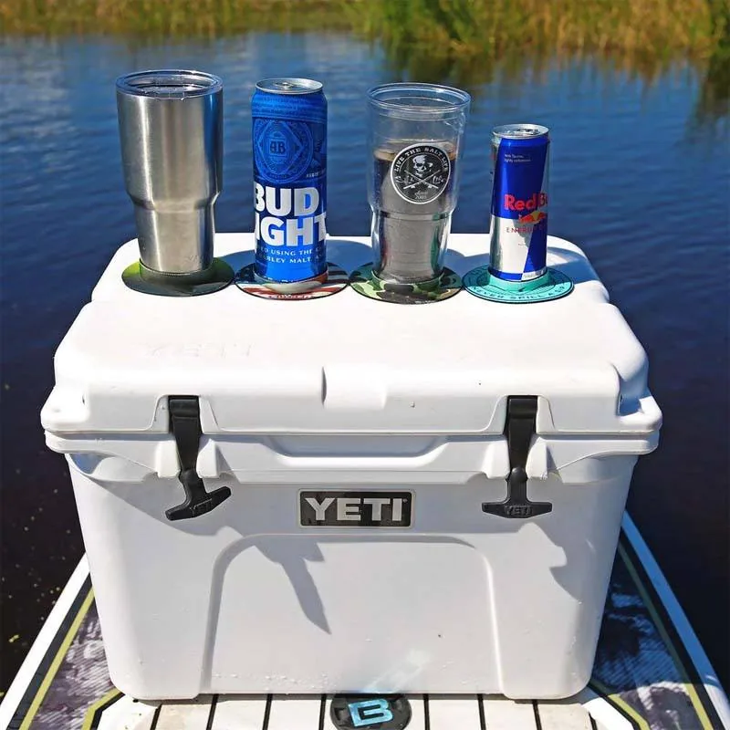 Source photo of different drink containers seated in rings on a cooler