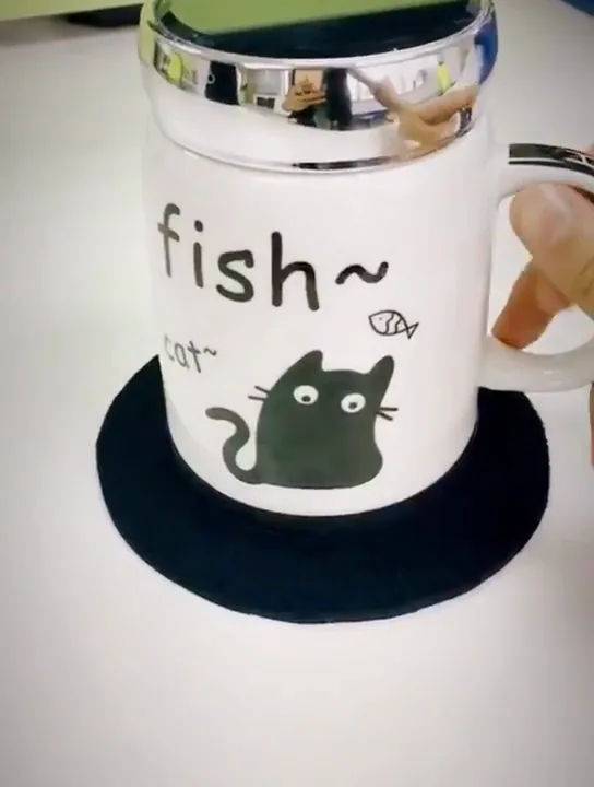 Actual video still of a mug seated in a black neoprene ring