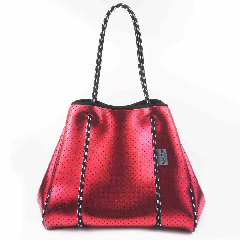 Red metallic-look perforated tote with rope handles